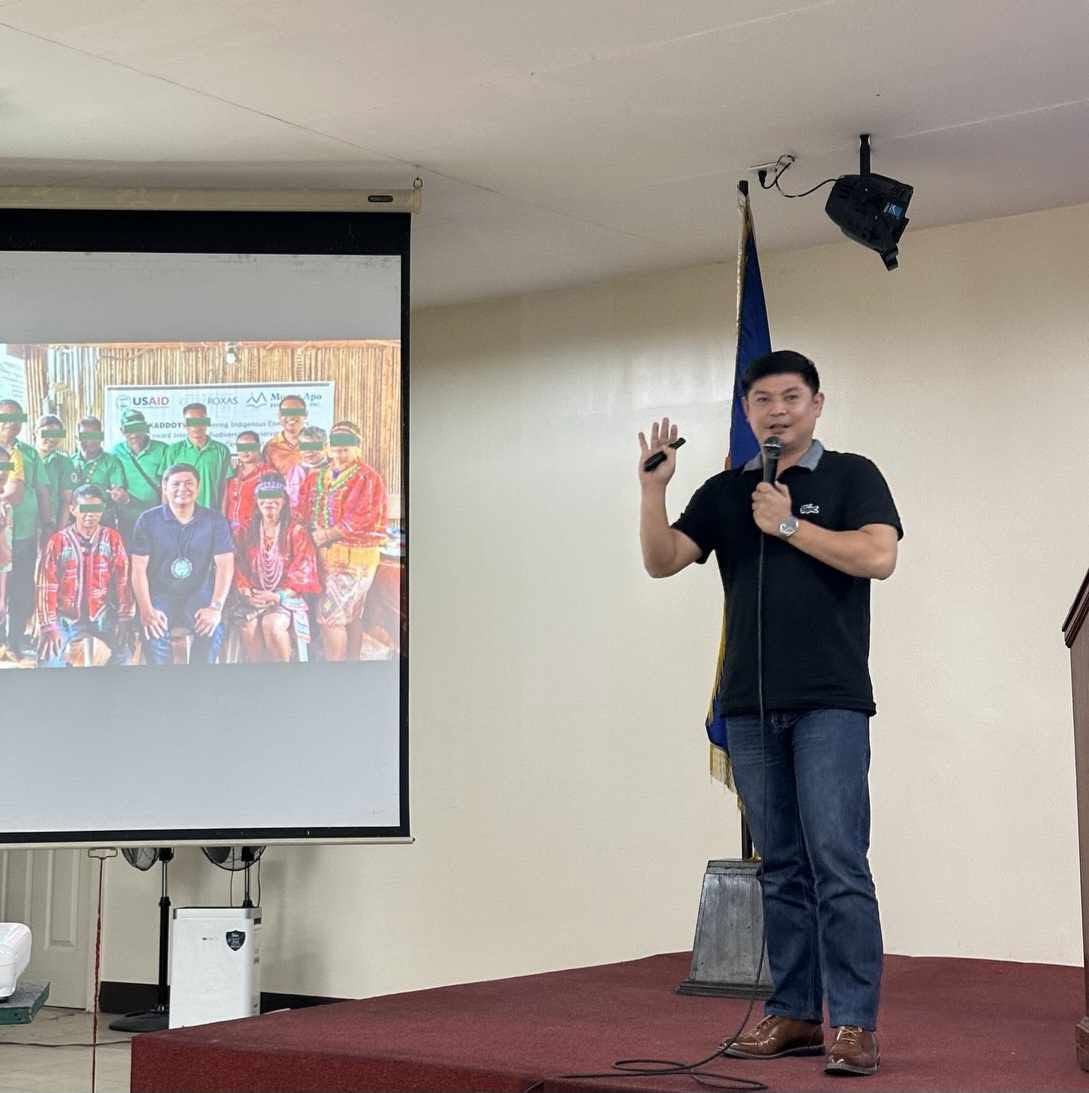 About 5 RM Nisperos presenting conservation-enterprise research for the USAID INSPIRE program at UP NCPAG